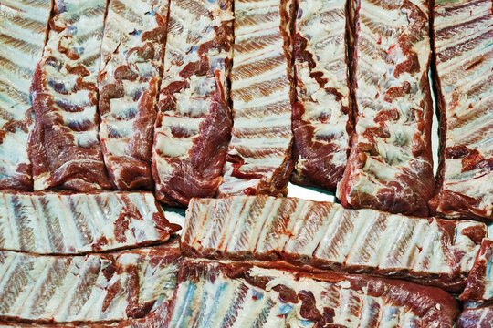 closeup view of raw marinated ribs ready for cooking