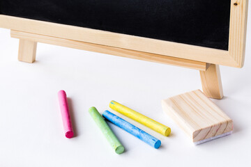 Wooden plank table for graphic stand product, interior design or montage display your product with blank texture blackboard with chalk for background. education concept.