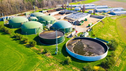 Biogas plant and farm in fields. Renewable energy from biomass. Agriculture prepared for Green Deal. Aerial view to Czech industry. Sustainable development in European Union.  - 763060396