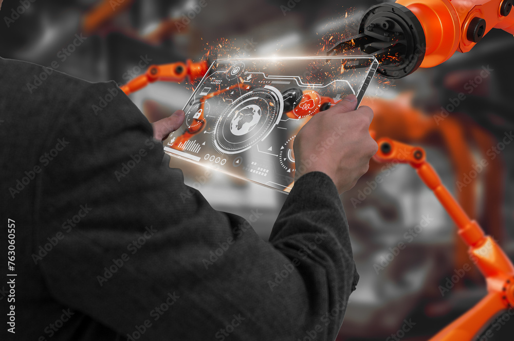Wall mural industry engineer in factory,using smart tablet glass device,control automated robot arm machine lea
