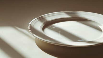 Simple white plate on a table, versatile for various uses