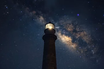 Foto op Aluminium A picturesque lighthouse under a night sky filled with stars. Perfect for travel or astronomy themes © Fotograf