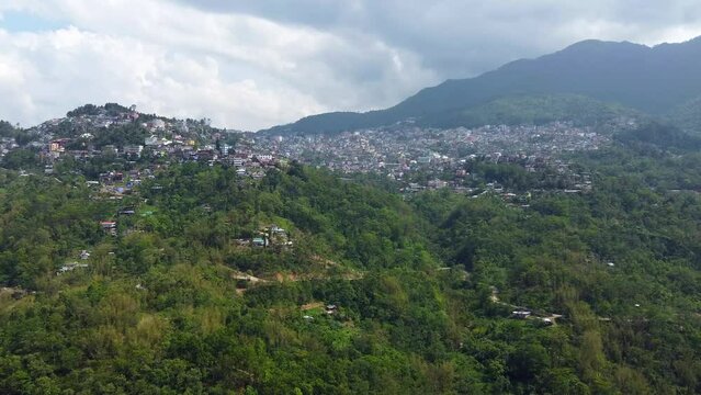 Aerial view of cityscape with buildings and homes along the hillside in kohima,nagaland in India