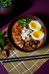 Ramen served in a bowl with egg, tofu, chicken breast, mushroom, sapporo, donkocheu, soup ramen, single serving, fine dining, Japanese cuisine, chives, food photography, restaurant menu