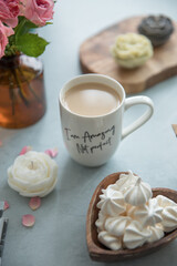 A portion of meringue in a small wooden plate in the shape of a heart