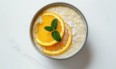 Keuken spatwand met foto Vibrant Breakfast Bowl: Wholesome Corn Porridge with Orange for a Nutritious Meal © verticalia