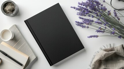 Elegant black notebook cover mockup with black pen and lavender flowers on minimalist background  
