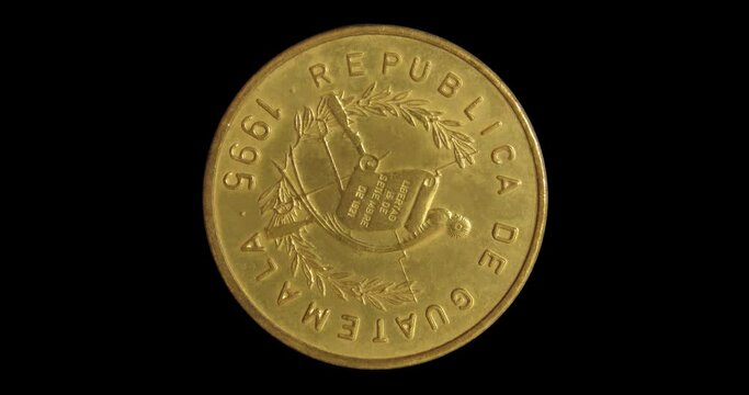 Obverse of Guatemala coin 1 centavo 1995, isolated in black background. Seamless animation in 4k resolution video.