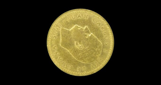 Obverse of Spain coin 1 peseta 1975 with portrait of king Juan Carlos I, isolated in black background. Loopable animation in 4k resolution video.