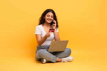 Woman shopping online with laptop and credit card