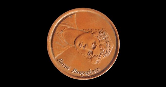 Obverse of Greece coin 2 drachmas 1988, isolated in black background. Seamless animation in 4k resolution video.