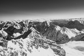 snow-covered mountains in black and white photo style. Mountainous landscape in monochrome photo...