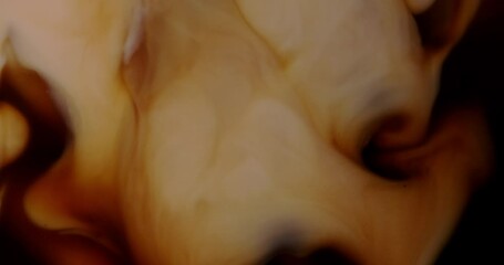 4K footage Front view Close-up SLO MO, Pour fresh milk mixed with fresh black coffee in a glass.