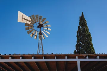 Foto op Canvas Wind powered water pump intavern in Sotira, Cyprus © Fotokon