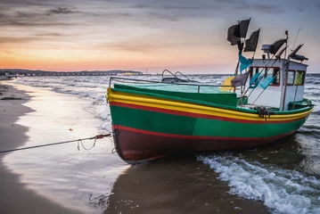 Fotobehang De Oostzee, Sopot, Polen Fishing boat on Baltic Sea beach in Karlikowo District in Sopot city, Poland