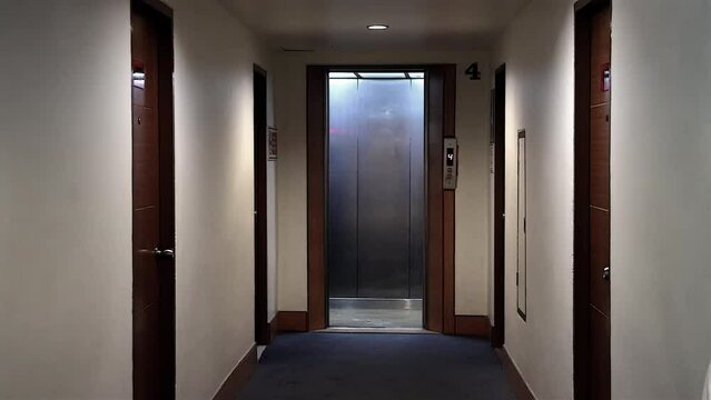 An empty elevator will arrive and the doors will open and close
