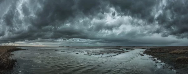 Foto op Plexiglas Dramatic storm clouds over wetlands © iVGraphic