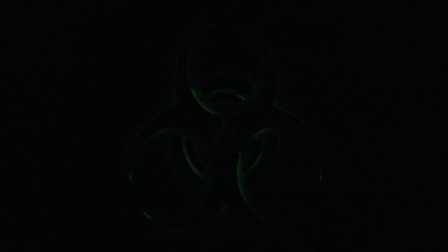 Real TV capture: a flickering green shape on black background, signaling a biohazard danger (biological substances threatening the health of living organisms, human beings).