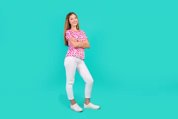 Gartenposter Full body photo of nice teen woman folded hands confident pose wear trendy print pink clothes isolated on cyan color background © deagreez