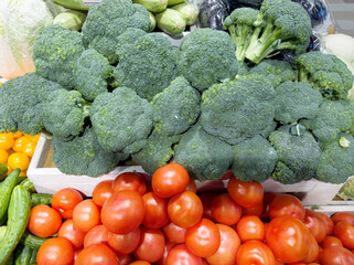 choosing peppers and  tomatoes at the grocery store