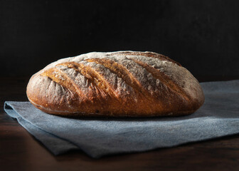 Homemade sourdough bread. Fresh Sourdough bread on a black background.