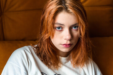 Adorable Red-Haired Teenage Girl Posing for a Captivating Portrait Photo