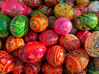 Fototapeta na wymiar Beautiful colorful decor for Easter. Traditional Easter painted colorful eggs. Selective focus.