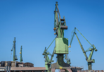 Cranes in Gdansk Shipyard in Gdansk city, Poland - obrazy, fototapety, plakaty