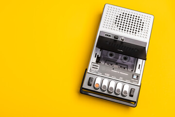 Vintage Portable Cassette Recorder on Yellow Background