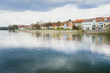 Colorful old houses reflected in the Danube River in Regensburg, Germany