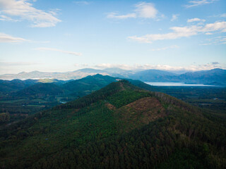 Obraz premium Aerial view silhouette mountainsunset light tropical forest sky with cloud nature landscape