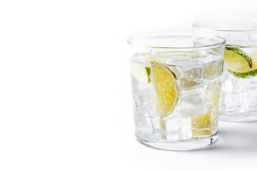 Glass of vodka tonic cocktail isolated on white background. Copy space