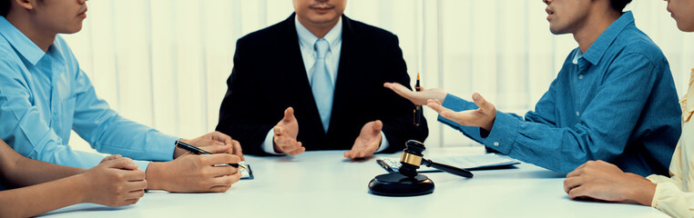 Lawyer acting as mediator broke a compromise between two parties to resolve business dispute through negotiation at law firm office. Legal mediation and conflict resolution service. Panorama Rigid