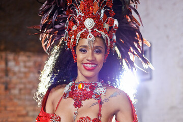 Portrait, costume and carnival for Brazilian female dancer, celebration and traditional festival. Dance, smile or samba for performance in Rio De Janeiro, headdress or concert for Mardi Gras