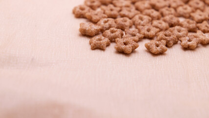 group of cereals shaped like stars on light background