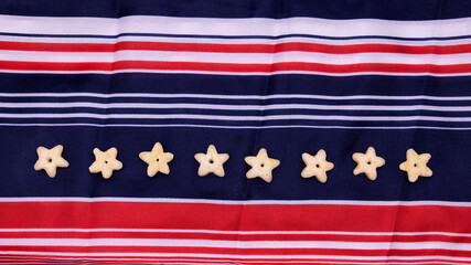 row of stars on blue and red striped background