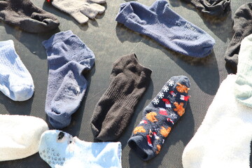 A pile of electric blue socks in plastic packaging on the table