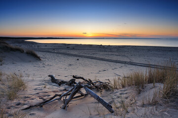 A beautiful sunset on the beach of the Sobieszewo Island at the Baltic Sea at spring. Poland - 763134962