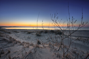 A beautiful sunset on the beach of the Sobieszewo Island at the Baltic Sea at spring. Poland - 763134989