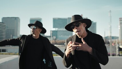 Music Video of African American band singing Hip Hop in the urban city
