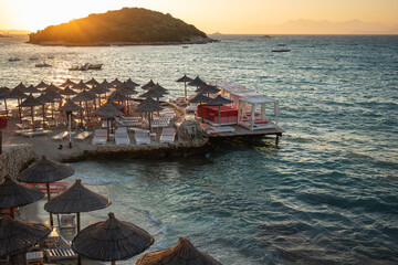 Beach Scenery of Ksamil Beach with its Island during Sunset. Summer Evening with Ionian Sea and...