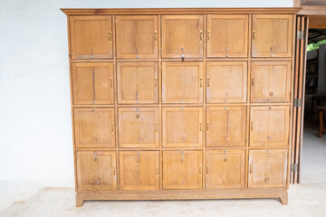 Wooden lockers in a locker room in the modern building, Locker room interior in modern fitness gym, free text space and empty room.