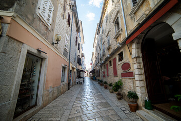 Fototapeta na wymiar A little cobbles street in a Mediterranean country