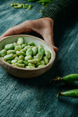 man with a bowl of broad beans - 763156718