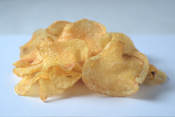 Potato chips isolated on white.