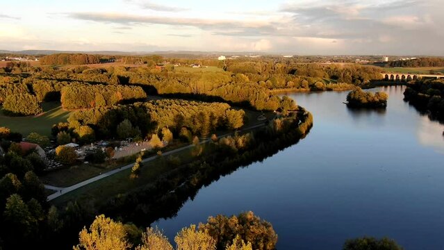Obersee Bielefeld Aerial view of lake, meadows and forest in sunshine - drone shot north rhine westphalia