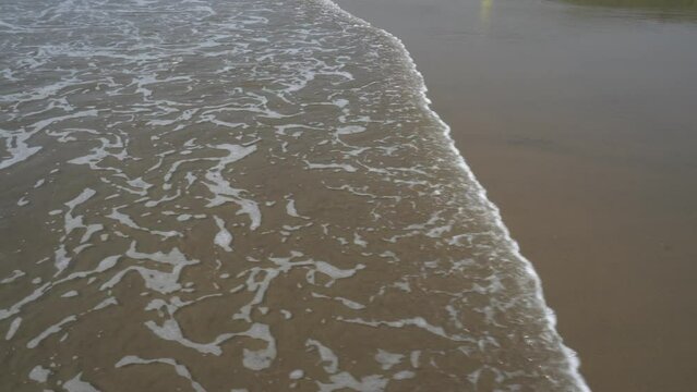Goa/ India 09 November 2020 The sea wave is coming and going on the shore at Baga Beach in North Goa