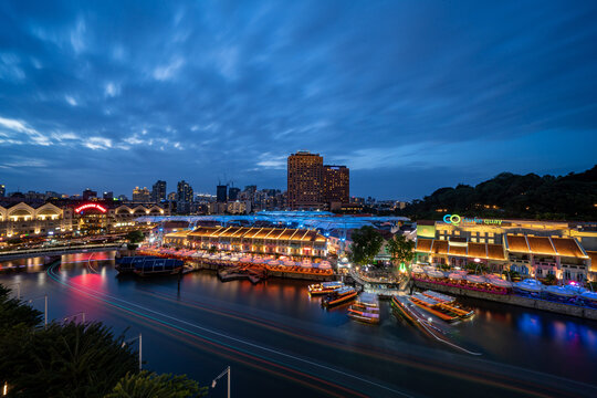 Singapore - December 25 2019: City view at Singapore clarke Quay area in the evening 
 before COVID.