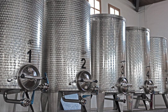 huge metal wine vats in wine cellar containers