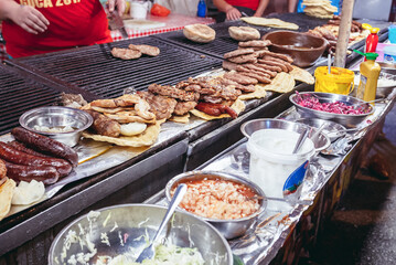 Food tent with pljeskavica - Balcan burgers during the Trumpet Festival in Guca village, Serbia